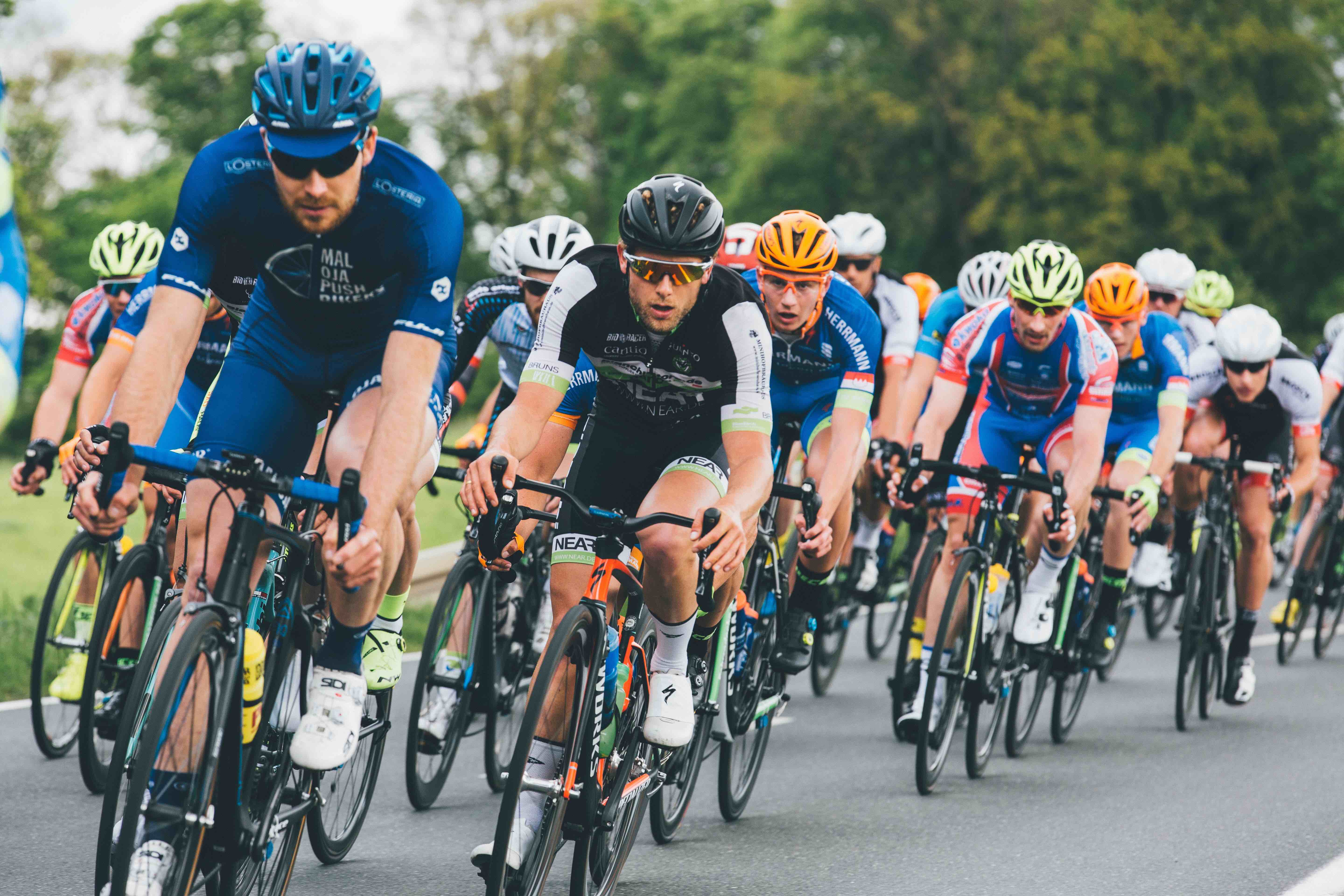 A pack of road cyclists racing